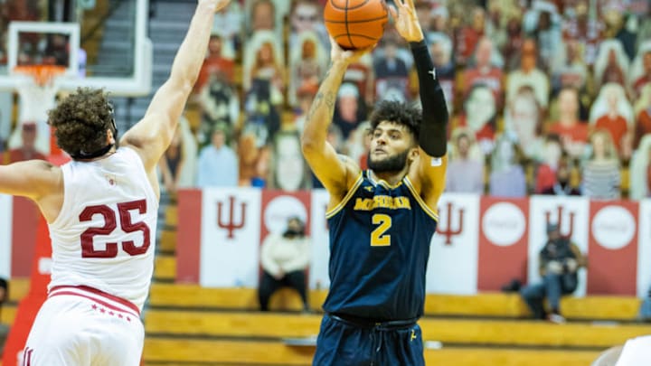 Feb 27, 2021; Bloomington, Indiana, USA; Michigan Wolverines forward Isaiah Livers (2) shoots the ball while Indiana Hoosiers forward Race Thompson (25) defends in the second half at Simon Skjodt Assembly Hall. Mandatory Credit: Trevor Ruszkowski-USA TODAY Sports