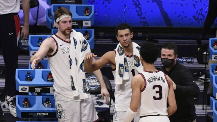 Mar 28, 2021; Indianapolis, IN, USA; Gonzaga Bulldogs guard Andrew Nembhard (3) is welcomed to the bench by forward Drew Timme (left) and guard Jalen Suggs (middle) in the second half against the Creighton Bluejays during the Sweet 16 of the 2021 NCAA Tournament at Hinkle Fieldhouse. Mandatory Credit: Doug McSchooler-USA TODAY Sports