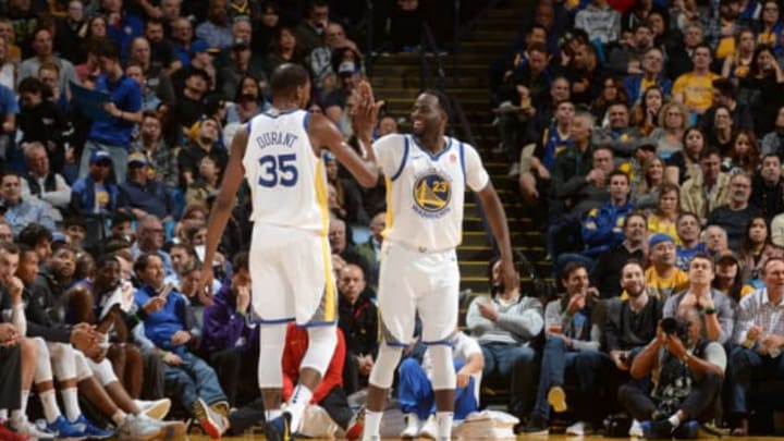 OAKLAND, CA – JANUARY 10: Draymond Green #23 and Kevin Durant #35 of the Golden State Warriors celebrate during the game against the LA Clippers on January 10, 2018 at ORACLE Arena in Oakland, California. NOTE TO USER: User expressly acknowledges and agrees that, by downloading and/or using this photograph, user is consenting to the terms and conditions of Getty Images License Agreement. Mandatory Copyright Notice: Copyright 2018 NBAE (Photo by Noah Graham/NBAE via Getty Images)