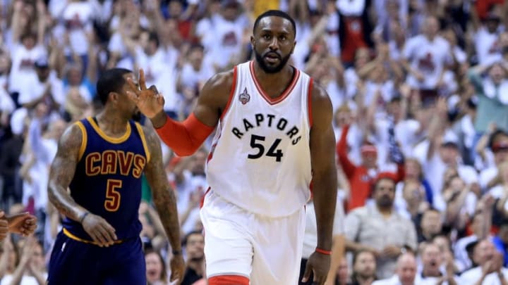 TORONTO, ON - MAY 23: Patrick Patterson #54 of the Toronto Raptors reacts after a three point basket in the first quarter against the Cleveland Cavaliers in game four of the Eastern Conference Finals during the 2016 NBA Playoffs at the Air Canada Centre on May 23, 2016 in Toronto, Ontario, Canada. NOTE TO USER: User expressly acknowledges and agrees that, by downloading and or using this photograph, User is consenting to the terms and conditions of the Getty Images License Agreement. (Photo by Vaughn Ridley/Getty Images)