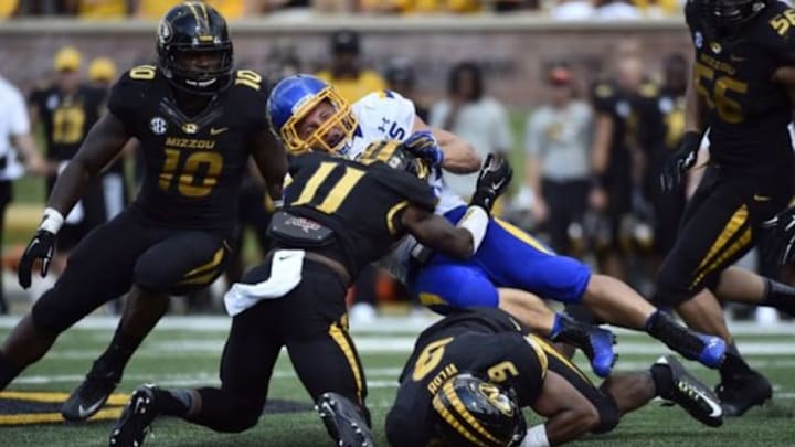 Aug 30, 2014; Columbia, MO, USA; South Dakota State Jackrabbits running back Zach Zenner (31) is tackled by Missouri Tigers safety Braylon Webb (9) during the second half at Faurot Field. Mandatory Credit: Jasen Vinlove-USA TODAY Sports Aug 30, 2014; Columbia, MO, USA; South Dakota State Jackrabbits running back Zach Zenner (31) is tackled by Missouri Tigers safety Braylon Webb (9) during the second half at Faurot Field. Mandatory Credit: Jasen Vinlove-USA TODAY Sports