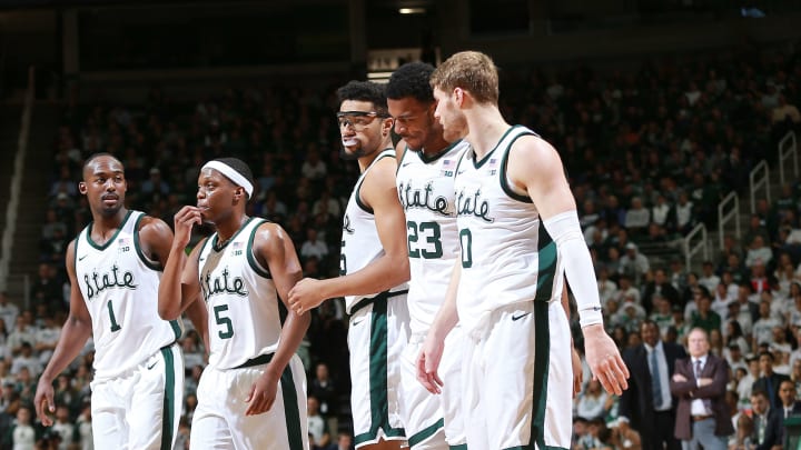 EAST LANSING, MI – DECEMBER 03: Joshua Langford #1, Cassius Winston #5, Kenny Goins #25, Xavier Tilman #23, and Kyle Ahrens #0 of the Michigan State Spartans walk on the the court after a timeout during a game against the Iowa Hawkeyes at Breslin Center on December 3, 2018 in East Lansing, Michigan. (Photo by Rey Del Rio/Getty Images)