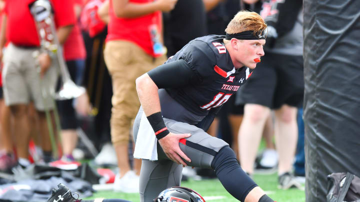 Alan Bowman #10 of the Texas Tech Red Raiders stretches before the game against the Lamar Cardinals on September 08, 2018 at Jones AT&T Stadium in Lubbock, Texas. (Photo by John Weast/Getty Images)
