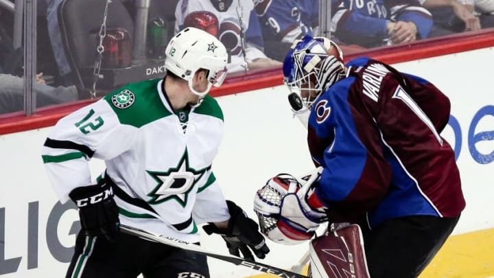 Oct 15, 2016; Denver, CO, USA; Colorado Avalanche goalie Semyon Varlamov (1) battles for the puck with Dallas Stars center Radek Faksa (12) in the second period at the Pepsi Center. Mandatory Credit: Isaiah J. Downing-USA TODAY Sports