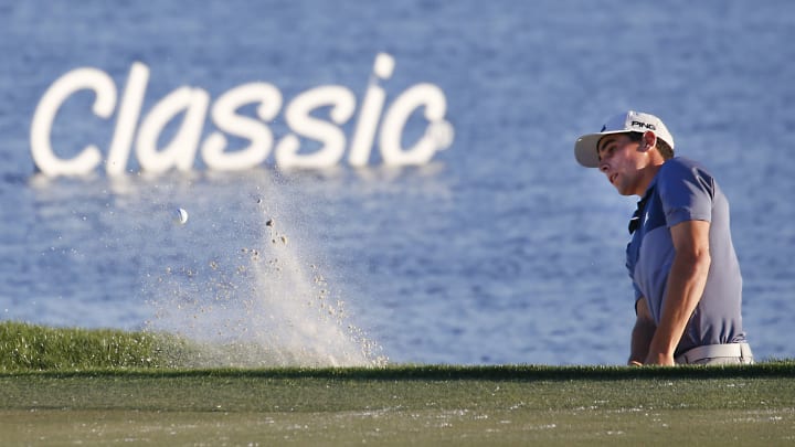 Feb 28, 2020; Palm Beach Gardens, Florida, USA; Joaquin Niemann hits from the bunker off of the 18th green during the second round of the 2020 Honda Classic golf tournament at PGA National (Champion). Mandatory Credit: Reinhold Matay-USA TODAY Sports