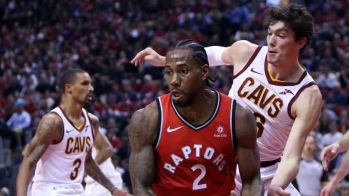 Kawhi Leonard #2 of the Toronto Raptors dribbles the ball as Cedi Osman #16 of the Cleveland Cavaliers defends. (Photo by Vaughn Ridley/Getty Images)