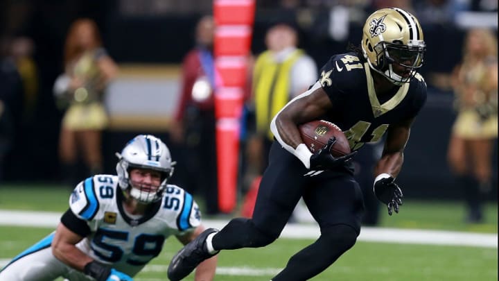 NEW ORLEANS, LA – JANUARY 07: Alvin Kamara #41 of the New Orleans Saints runs for a first down past Luke Kuechly #59 of the Carolina Panthers during the first half of the NFC Wild Card playoff game at the Mercedes-Benz Superdome on January 7, 2018 in New Orleans, Louisiana. (Photo by Sean Gardner/Getty Images)