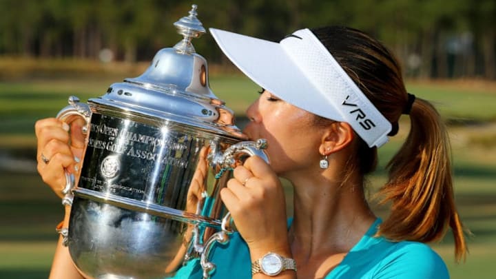 Michelle Wie of the United States celebrates with the trophy after winning in the final round of the 69th U.S. Women's Open at Pinehurst Resort