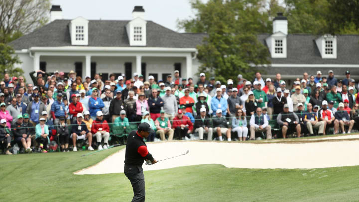 AUGUSTA, GA – APRIL 08: Tiger Woods of the United States plays his third shot on the ninth hole during the final round of the 2018 Masters Tournament at Augusta National Golf Club on April 8, 2018 in Augusta, Georgia. (Photo by Jamie Squire/Getty Images)