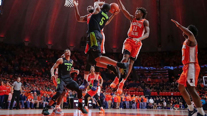 CHAMPAIGN, IL – FEBRUARY 05: Cassius Winston #5 of the Michigan State Spartans goes up for the shot against Kipper Nichols #2 and Ayo Dosunmu #11 of the Illinois Fighting Illini at State Farm Center on February 5, 2019 in Champaign, Illinois. (Photo by Michael Hickey/Getty Images)