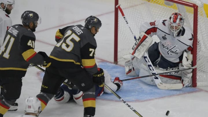 LAS VEGAS NV - MAY 28: Vegas right wing Ryan Reaves (75) grabs the loose puck to make the game tying goal at 4 in the 3rd against Washington goaltender Braden Holtby (70) during as game between the Washington Capitals and the Vegas Golden Knights in game one of the Stanley Cup finals in Las Vegas NV on May 28, 2018. (Photo by John McDonnell/The Washington Post via Getty Images)