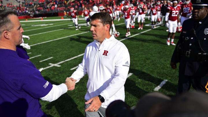 PISCATAWAY, NJ – OCTOBER 20: Head coach Chris Ash (C) of the Rutgers Scarlet Knights greets Head coach Pat Fitzgerald of the Northwestern Wildcats after the game on October 20, 2018 in Piscataway, New Jersey. Northwestern won 18-15. (Photo by Corey Perrine/Getty Images)