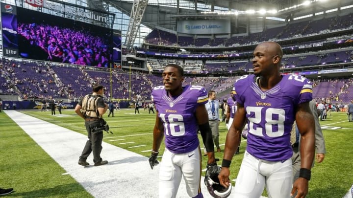 Aug 28, 2016; Minneapolis, MN, USA; Minnesota Vikings wide receiver Terrell Sinkfield (16) and running back Adrian Peterson (28) leave the field after defeating the San Diego Chargers 23-10 at U.S. Bank Stadium. Mandatory Credit: Bruce Kluckhohn-USA TODAY Sports