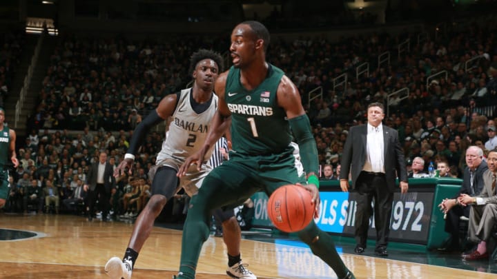 EAST LANSING, MI - DECEMBER 21: Joshua Langford #1 of the Michigan State Spartans drives past Tray Maddoc Jr. #2 of the Oakland Golden Grizzlies in the first half at Breslin Center on December 21, 2018 in East Lansing, Michigan. (Photo by Rey Del Rio/Getty Images)