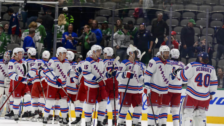 Mar 12, 2022; Dallas, Texas, USA; The New York Rangers celebrate the win over the Dallas Stars at the American Airlines Center. Mandatory Credit: Jerome Miron-USA TODAY Sports