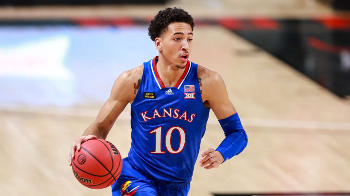 LUBBOCK, TEXAS – DECEMBER 17: Forward Jalen Wilson #10 of the Kansas Jayhawks handles the ball during the first half of the college basketball game against the Texas Tech Red Raiders at United Supermarkets Arena on December 17, 2020 in Lubbock, Texas. (Photo by John E. Moore III/Getty Images)