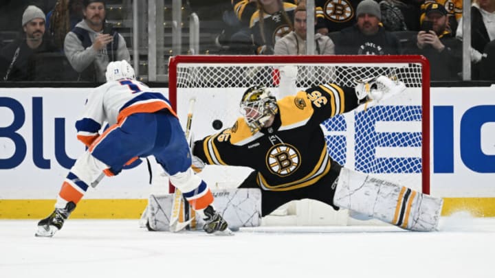 BOSTON, MASSACHUSETTS - DECEMBER 13: Mathew Barzal #13 of the New York Islanders scores a goal on Linus Ullmark #35 of the Boston Bruins during an overtime shootout at the TD Garden on December 13, 2022 in Boston, Massachusetts. (Photo by Brian Fluharty/Getty Images)