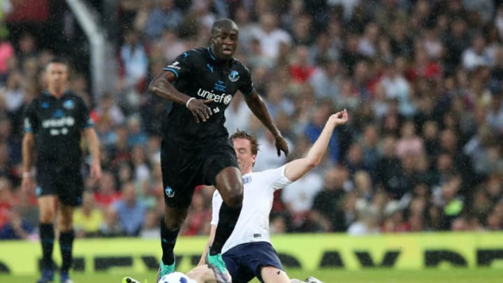 MANCHESTER, ENGLAND - JUNE 10: Damian Lewis and Yaya Toure fight for the ball during the Soccer Aid for UNICEF 2018 match between England and The Rest of the World at Old Trafford on June 10, 2018 in Manchester, England. (Photo by Lynne Cameron/Getty Images)