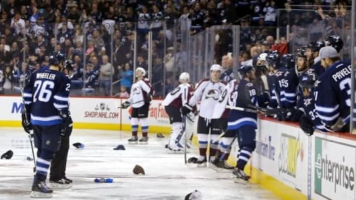 Dec 5, 2014; Winnipeg, Manitoba, CAN; Winnipeg Jets fans celebrate the third goal of the game from forward Bryan Little (18) during the third period against Colorado Avalanche at MTS Centre. Winnipeg wins 6-2. Mandatory Credit: Bruce Fedyck-USA TODAY Sports