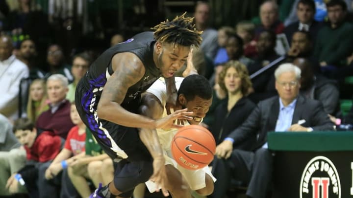 Dec 29, 2015; Birmingham, AL, USA; UAB Blazers guard Robert Brown (4) goes for the ball with Stephen F. Austin Lumberjacks guard Ty Charles (4) at Bartow Arena. The Blazers defeated the Lumberjacks 76-66. Mandatory Credit: Marvin Gentry-USA TODAY Sports