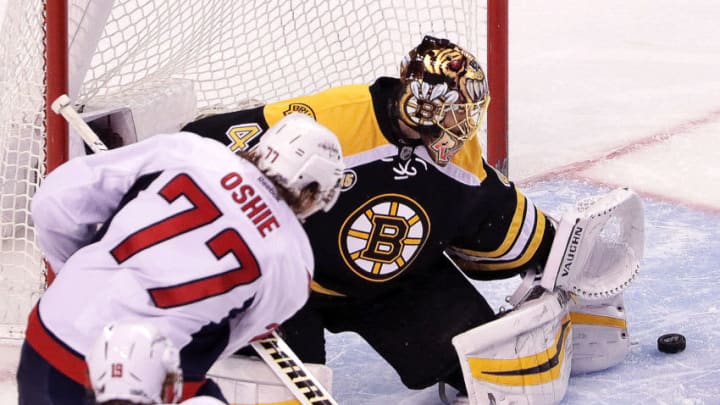 BOSTON - APRIL 8: Boston Bruins goalie Tuukka Rask (40) turns away a shot by Washington Capitals right wing T.J. Oshie (77) in the third period. The Boston Bruins host the Washington Capitals in the regular-season finale at TD Garden in Boston on Apr. 8, 2017. (Photo by Barry Chin/The Boston Globe via Getty Images)