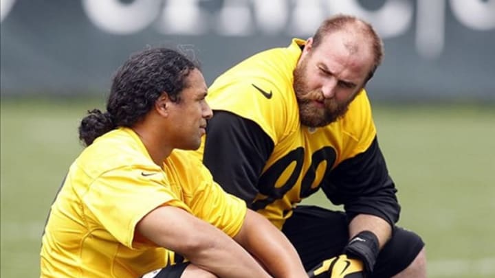 Jun 11, 2013; Pittsburgh, PA, USA; Pittsburgh Steelers safety Troy Polamalu (left) and defensive end Brett Keisel (right) talk on the sidelines during minicamp at the UPMC Sports Complex. Mandatory Credit: Charles LeClaire-USA TODAY Sports