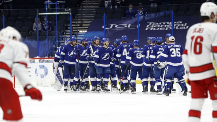 Feb 24, 2021; Tampa, Florida, USA; Tampa Bay Lightning left wing Ross Colton (79) and teammates celebrate as they beat the Carolina Hurricanes during the second period at Amalie Arena. Mandatory Credit: Kim Klement-USA TODAY Sports