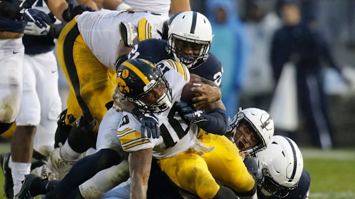 STATE COLLEGE, PA – OCTOBER 27: Amani Oruwariye #21 of the Penn State Nittany Lions tackles Mekhi Sargent #10 of the Iowa Hawkeyes on October 27, 2018 at Beaver Stadium in State College, Pennsylvania. (Photo by Justin K. Aller/Getty Images)