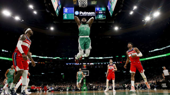 Apr 3, 2022; Boston, Massachusetts, USA; Boston Celtics guard Jaylen Brown (7) goes in for a dunk as Washington Wizards guard Kentavious Caldwell-Pope (1) and forward Rui Hachimura (8) look on during the first half at TD Garden. Mandatory Credit: Winslow Townson-USA TODAY Sports