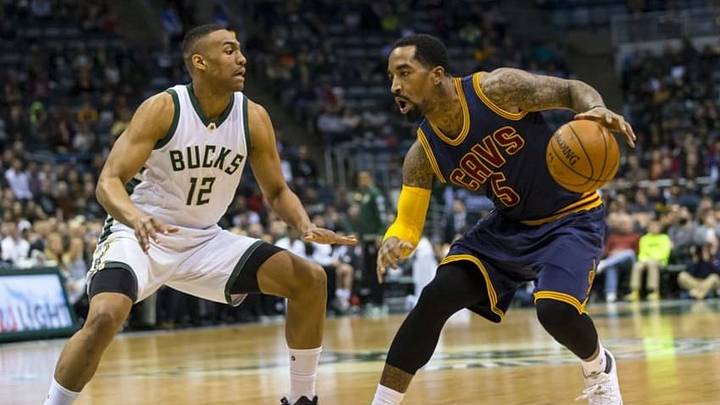 Apr 5, 2016; Milwaukee, WI, USA; Cleveland Cavaliers guard J.R. Smith (5) drives for the basket as Milwaukee Bucks forward Jabari Parker (12) defends during the first quarter at BMO Harris Bradley Center. Mandatory Credit: Jeff Hanisch-USA TODAY Sports