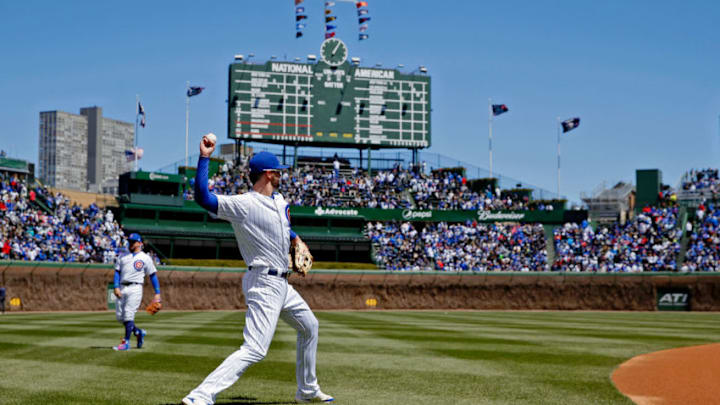 CHICAGO, IL - APRIL 28: Kris Bryant #17 of the Chicago Cubs warms up before the game against the Milwaukee Brewers, in his first start since being hit by a pitch severeal days ago, at Wrigley Field on April 28, 2018 in Chicago, Illinois. (Photo by Jon Durr/Getty Images)