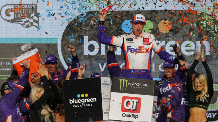 AVONDALE, ARIZONA - NOVEMBER 10: Denny Hamlin, driver of the #11 FedEx Ground Toyota, celebrates in Victory Lane after winning the Monster Energy NASCAR Cup Series Bluegreen Vacations 500 at ISM Raceway on November 10, 2019 in Avondale, Arizona. (Photo by Jonathan Ferrey/Getty Images)