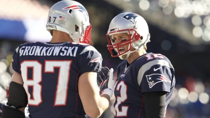 Dec 20, 2015; Foxborough, MA, USA; New England Patriots quarterback Tom Brady (12) and tight end Rob Gronkowski (87) warm up before the start of the game against the Tennessee Titans at Gillette Stadium. Mandatory Credit: David Butler II-USA TODAY Sports
