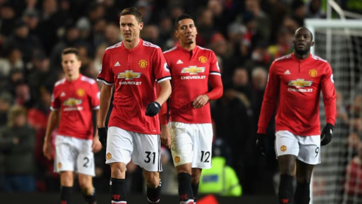 MANCHESTER, ENGLAND - DECEMBER 10: Nemanja Matic, Chris Smalling and Romelu Lukaku of Manchester United look dejected after the 2nd MAcnhester City goal during the Premier League match between Manchester United and Manchester City at Old Trafford on December 10, 2017 in Manchester, England. (Photo by Michael Regan/Getty Images)