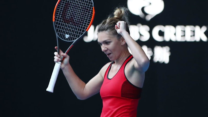 MELBOURNE, AUSTRALIA - JANUARY 25: Simona Halep of Romania celebrates winning her semi-final match against Angelique Kerber of Germany on day 11 of the 2018 Australian Open at Melbourne Park on January 25, 2018 in Melbourne, Australia. (Photo by Clive Brunskill/Getty Images)