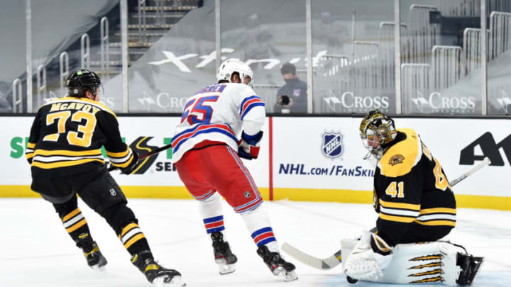 Mar 11, 2021; Boston, Massachusetts, USA; Boston Bruins goaltender Jaroslav Halak (41) makes a save on New York Rangers defenseman Ryan Lindgren (55) while defenseman Charlie McAvoy (73) during the second period at TD Garden. Mandatory Credit: Bob DeChiara-USA TODAY Sports