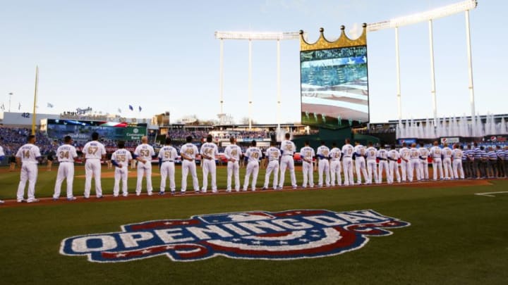 KANSAS CITY, MO - APRIL 03: The Kansas City Royals and the New York Mets line the field during the National Anthem ahead of their opening day game at Kauffman Stadium on April 3, 2016 in Kansas City, Missouri. (Photo by Jamie Squire/Getty Images)