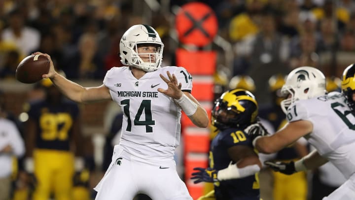 ANN ARBOR, MI – OCTOBER 07: Brian Lewerke #14 of the Michigan State Spartans drops back to pass during the second quarter of the game against the Michigan Wolverines at Michigan Stadium on October 7, 2017 in Ann Arbor, Michigan. (Photo by Leon Halip/Getty Images)