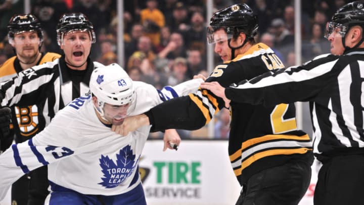 BOSTON, MA - DECEMBER 08: Boston Bruins Defenceman Brandon Carlo (25) gets into a fist fight after the play with Toronto Maple Leafs Center Nazem Kadri (43). During the Boston Bruins game against the Toronto Maple Leafs on December 8, 2018 at TD Garden in Boston, MA.(Photo by Michael Tureski/Icon Sportswire via Getty Images)