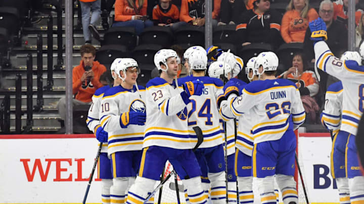 Apr 1, 2023; Philadelphia, Pennsylvania, USA; Buffalo Sabres defenseman Mattias Samuelsson (23) and right wing Jack Quinn (22) celebrate win against the Philadelphia Flyers at Wells Fargo Center. Mandatory Credit: Eric Hartline-USA TODAY Sports