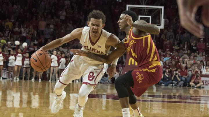 NORMAN, OK - MARCH 2: Trae Young #11 of the Oklahoma Sooners drives around Donovan Jackson #4 of the Iowa State Cyclones during the second half of a NCAA college basketball game at the Lloyd Noble Center on March 2, 2018 in Norman, Oklahoma. (Photo by J Pat Carter/Getty Images)