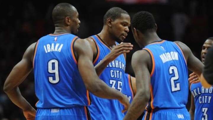 December 21, 2015; Los Angeles, CA, USA; Oklahoma City Thunder forward Kevin Durant (35) celebrates with forward Serge Ibaka (9) and guard Anthony Morrow (2) the 100-99 victory against Los Angeles Clippers following the second half at Staples Center. Mandatory Credit: Gary A. Vasquez-USA TODAY Sports