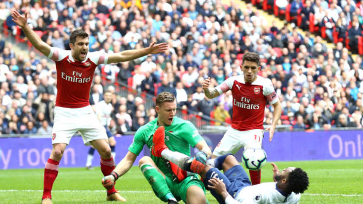 LONDON, ENGLAND - MARCH 02: Danny Rose of Tottenham Hotspur fouls Bernd Leno of Arsenal during the Premier League match between Tottenham Hotspur and Arsenal FC at Wembley Stadium on March 02, 2019 in London, United Kingdom. (Photo by Clive Rose/Getty Images)