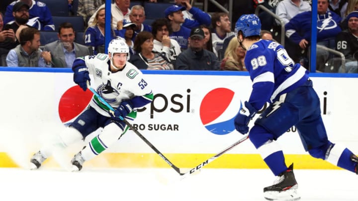 Jan 7, 2020; Tampa, Florida, USA; Vancouver Canucks center Bo Horvat (53) skates with the puck as Tampa Bay Lightning defenseman Mikhail Sergachev (98) defends during the second period at Amalie Arena. Mandatory Credit: Kim Klement-USA TODAY Sports