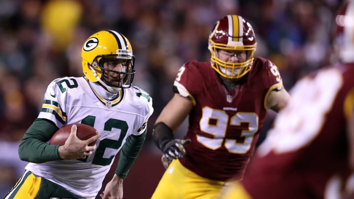 LANDOVER, MD – NOVEMBER 20: Quarterback Aaron Rodgers #12 of the Green Bay Packers carries the ball against defensive end Trent Murphy #93 of the Washington Redskins in the second quarter at FedExField on November 20, 2016 in Landover, Maryland. (Photo by Rob Carr/Getty Images)