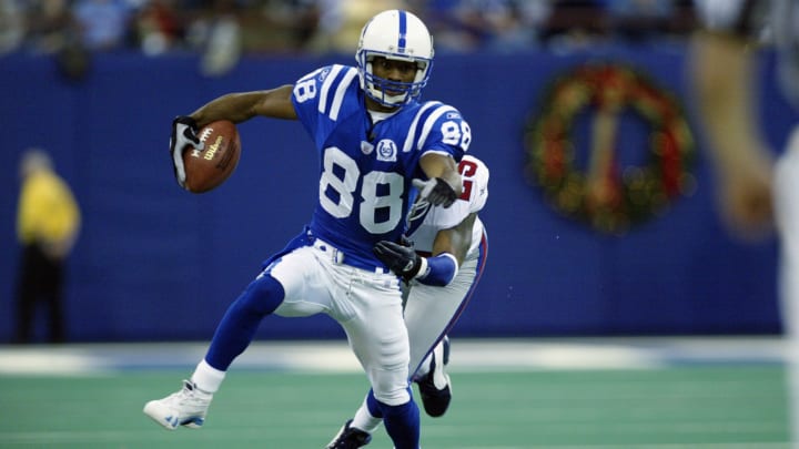 INDIANAPOLIS – DECEMBER 22: Marvin Harrison #88 of the Indianapolis Colts is tackled from behind by Will Allen #25 of the New York Giants during the NFL game on December 22, 2002 at the RCA Dome in Indianapolis, Indiana. The Giants defeated the Colts 44-27. (Photo by Jeff Gross/Getty Images)