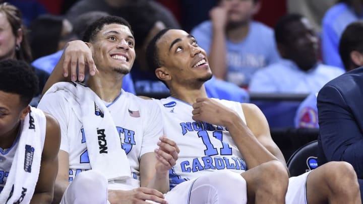 Mar 19, 2016; Raleigh, NC, USA; North Carolina Tar Heels forward Brice Johnson (11) and forward Justin Jackson (44) look on from the bench during the final moments of their game against the Providence Friars during the second round of the 2016 NCAA Tournament at PNC Arena. The Tar Heels won 85-66. Mandatory Credit: Bob Donnan-USA TODAY Sports