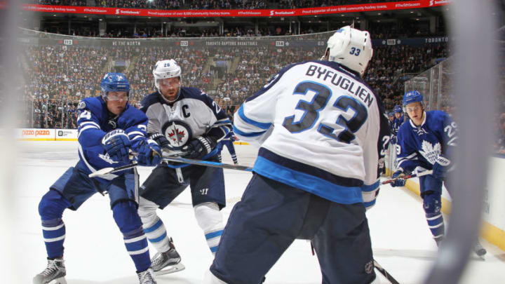 TORONTO,ON - FEBRUARY 21: Dustin Byfuglien #33 of the Winnipeg Jets looks to clear a puck out against the Toronto Maple Leafs during an NHL game at Air Canada Centre on February 21, 2017 in London, Ontario, Canada. The Maple Leafs defeated the Jets 5-4 in overtime. (Photo by Claus Andersen/Getty Images)