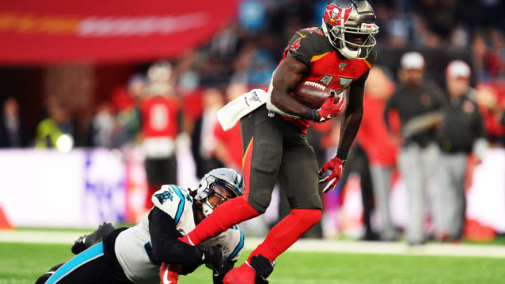 LONDON, ENGLAND - OCTOBER 13: Shaq Thompson of Carolina Panthers tackles Chris Godwin of Tampa Bay Buccaneers during the NFL match between the Carolina Panthers and Tampa Bay Buccaneers at Tottenham Hotspur Stadium on October 13, 2019 in London, England. (Photo by Alex Burstow/Getty Images)