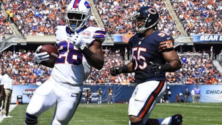 Sep 7, 2014; Chicago, IL, USA; Buffalo Bills running back C.J. Spiller (28) rushes rushes for a touchdown against Chicago Bears outside linebacker Lance Briggs (55) during the second quarter at Soldier Field. Mandatory Credit: Mike DiNovo-USA TODAY Sports